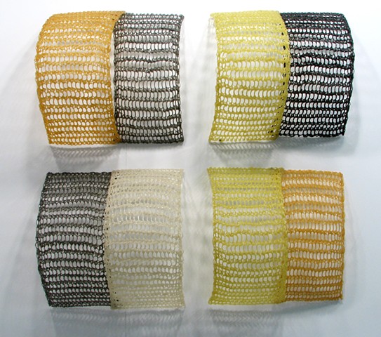 Crocheted fiberglass and polyester resin grid wall sculpture based on the number e  by Yvette Kaiser Smith