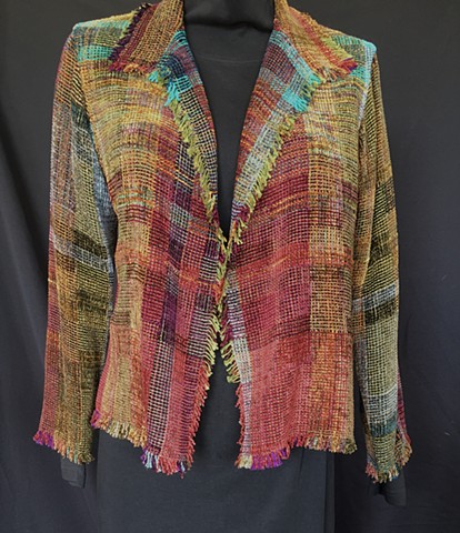 Handwoven fringed jacket of rayon chenille, cotton and bamboo yarns