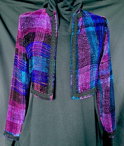 Handwoven bolero jacket and scarf of rayon chenille, cotton and bamboo yarns.