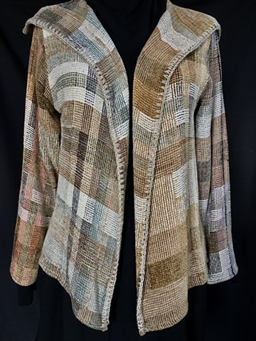 Handwoven lapel jacket of rayon chenille, cotton and bamboo yarns.