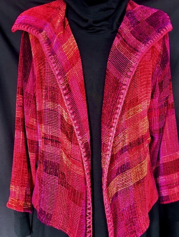 Handwoven lapel jacket of rayon chenille, cotton and bamboo yarns.
