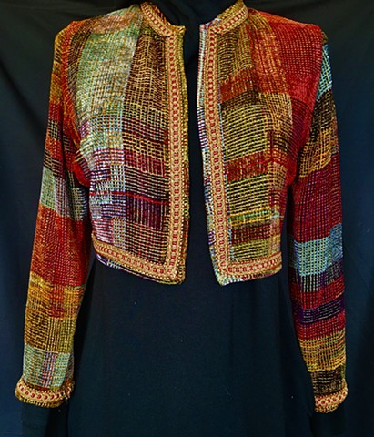 Handwoven bolero jacket of rayon chenille, cotton and bamboo yarns.