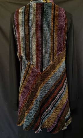 Handwoven long vest of rayon chenille, cotton and bamboo yarns.