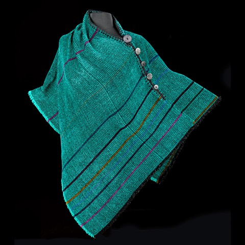Handwoven Poncho of rayon chenille, cotton and bamboo yarns.  Hand-embellished with crochet and buttons.