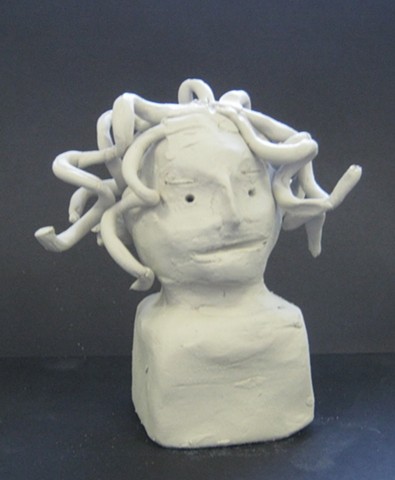 6th grade miniature self-portrait clay bust as Medusa  