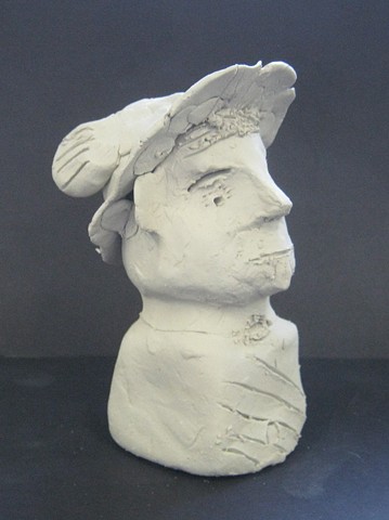6th grade miniature self-portrait clay bust as Mercury 
