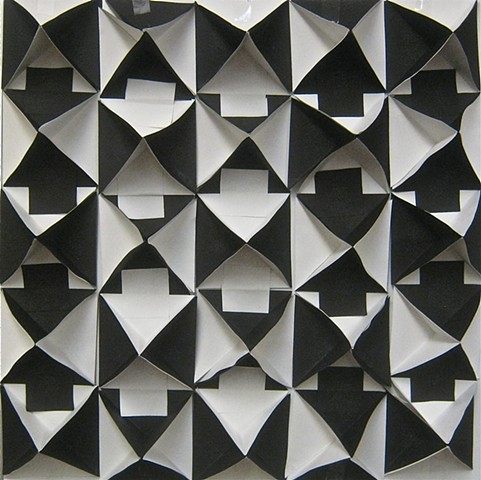 Black and white construction paper tessellating tetrahedrons relief sculpture
