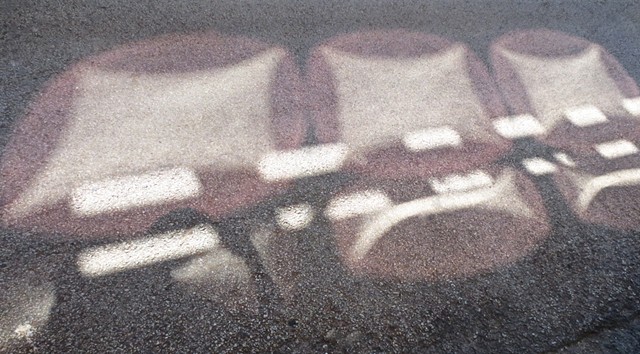 Digital Photograph of light reflections on asphalt