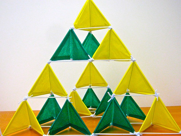 Yellow and Green Sierpinski pyramid made with plastic straws,pipe cleaner, and tissue paper 