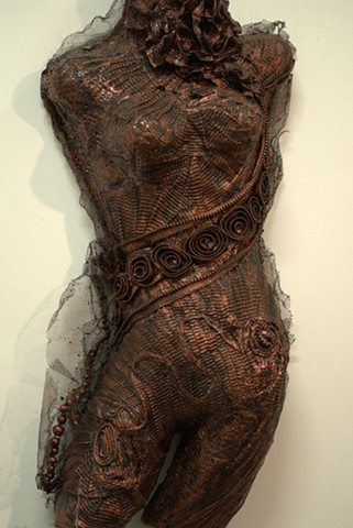 Mixed Media Molded Body Sculpture hangs on wall