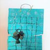 MIX 2017 

#12
Mixed agate shards on plastic mesh grid ornament over metallic cardstock with metallic twistie hanger

2017