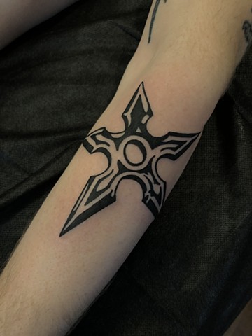 Throwing star tattoo by Connie Kang