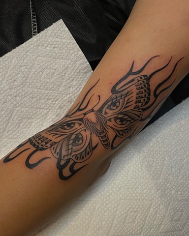 Moth eyes flame tattoo by Alecia Thomasson