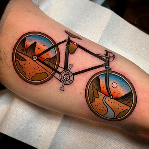 bike and landscape tattoo by dave wah at stay humble tattoo company in baltimore maryland the best tattoo shop and artist in baltimore maryland