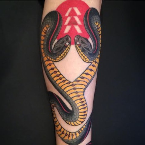Double headed ssnake tattoo done by Fran Massino