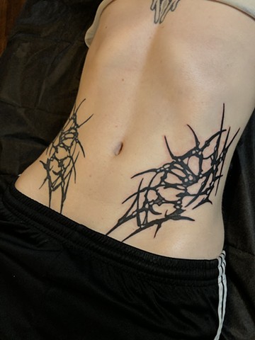 Abstract stomach tattoo by Connie Kang