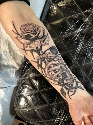 Skeleton hand holding rose by Connie Kang