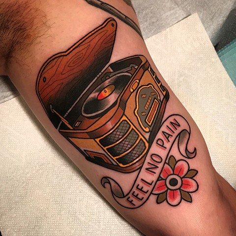 vintage antique record player tattoo by dave wah at stay humble tattoo company in baltimore maryland the best tattoo shop and artist in baltimore maryland