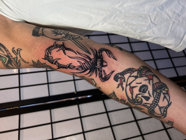 Barbed wire scorpion tattoo by Jason Ziegler
