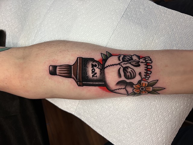 Skull and whiskey tattoo by Jason Ziegler 