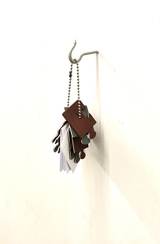 Conceptual art, Contemporary Art, Sculpture, Wood, Bob Fields, "Untitled (Assembly required. Completion? Takes longer.)," 2023. Aerosol shellac and lacquer on plywood, strung on a beaded chain. 10" X 3" X 6".