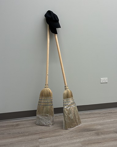 Contemporary Art, Minimal Art, Conceptual Art, Robert Fields, “If I am only for myself, what am I?” ~Hillel (49 BCE-24 CE), 2026.  Baseball caps, a pair, and brooms (two), 58 x 24 x 18 Inches.