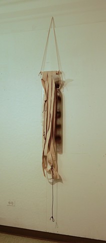 A contemporary, post minimalist wall-hung sculpture with elements of formalism & materiality. A mixed media assemblage of cotton belting, poly film, foam rubber, wood and cotton rope.  "I had no other choice but to..."2018,.  By Robert Fields,
