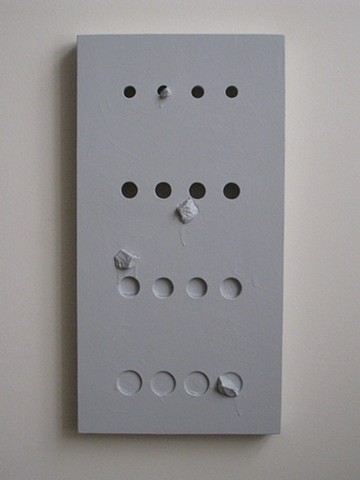 A abstract sculpture, as a painted wood, wall panel with inclusions of marble chips, “We were devoted to the sea, but not anymore," 2015, by Robert Fields