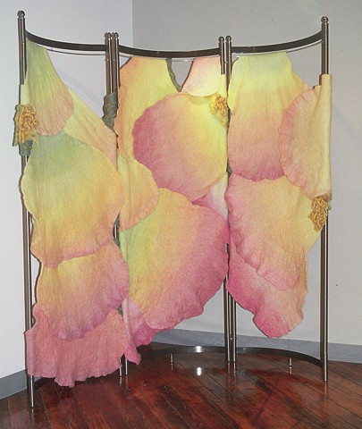 A handmade felt screen which works in a corner or as a room divider. It was made of dyed, unspun wool and yarns by Sharron Parker, It was based on Peace Rose petals.