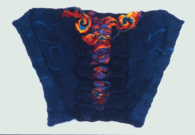 A handmade felt wall piece made of dyed, unspun wool and  yarns, by Sharron Parker.  Abstract but with a reference to the Phoenix rising from ashes.