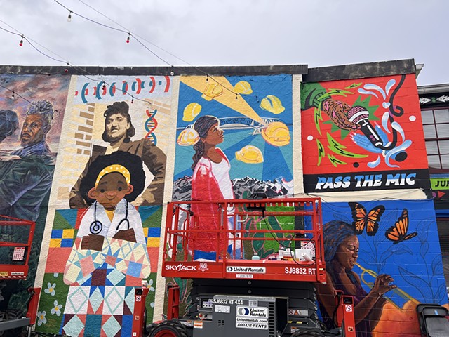 Between Danamarie Hosler and Camila LeÃ£o & Bunny Blue's mural