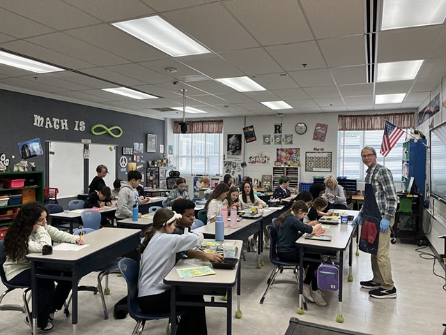 Marc in Classroom Leading Painting Session