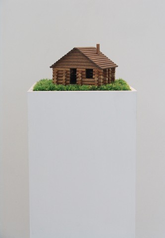 log cabin kit with tiny pencil text write on it