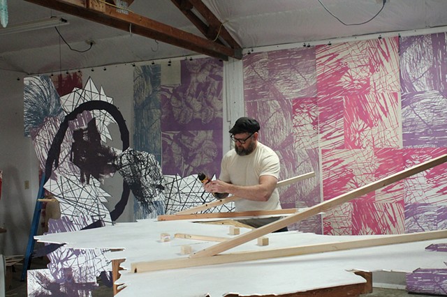 Working on "FUSION FIELD". Wheat pasting prints to 3D cut outs and constructing wooden stands for them.