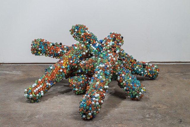 sculpture with marbles and found materials