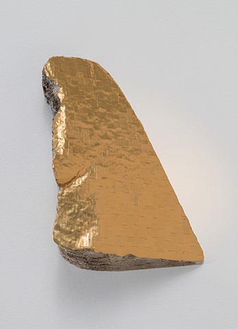 sculpture with gold tape and found foam material