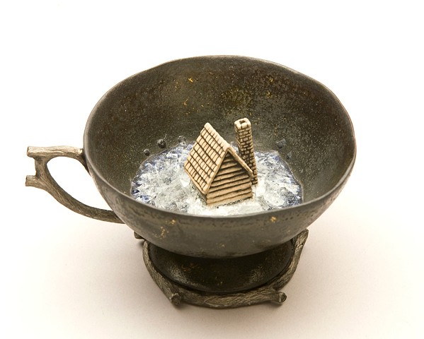 porcelain teacup with house and glass