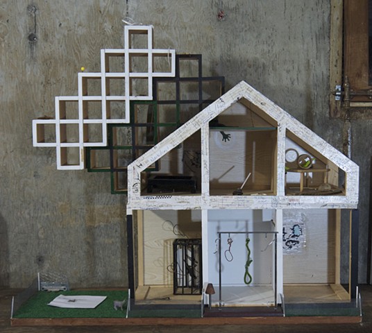 This Assemblage, art, "Found Objects" piece uses different found objects and paint on a dollhouse to describe the different rooms in a brain and evoke feelings of melancholy 