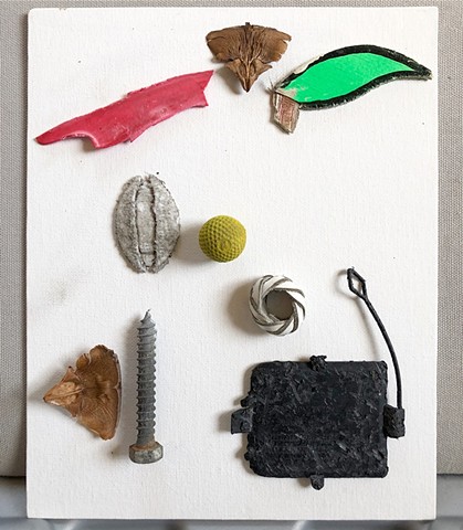 This found object assemblage showing an abstract bird was made using objects found on that day, and glued to a canvas board