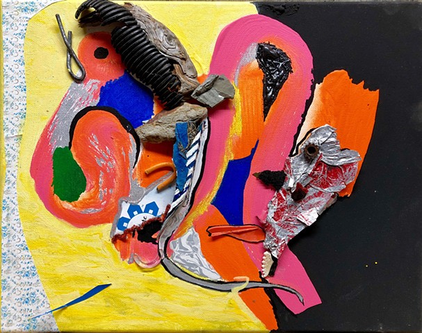 This mixed media piece by Steven Tannenbaum uses found objects, paint, and paper to create a semi abstract fish and bird sculpture