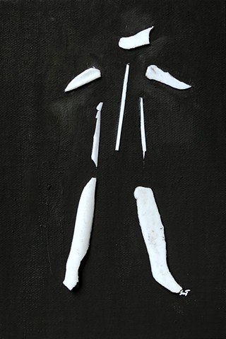 A simple black and white found object work that uses broken plastic pieces to form the shape of a man