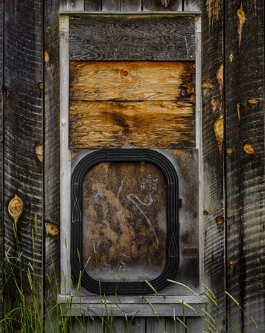 Boarded Window With Plywood and Slotcar Track-Austin, Oregon