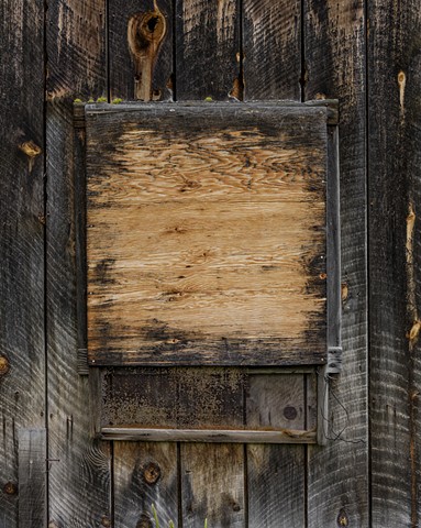 Boarded Window With Plywood and Screen-Austin, Oregon