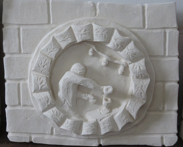A clay relief of a faux brick wall with decorative wreath, depicting a bartender/alchemist pouring spirits from a bottle.