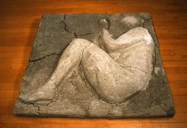 cast dirt self portrait with footsteps and full body image curled up