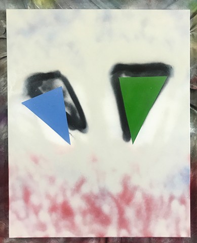 blue and green triangles floating above a white field with shadows