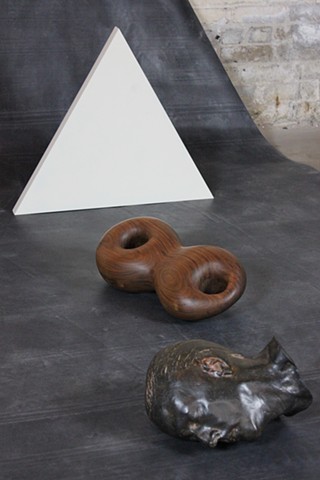installation + death mask + cast iron arm with wood+ roll of rubber
