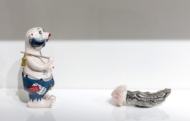 detail showing: 'Hideous vintage Kreiss ceramic hobo bear with replaced bindle stick and bag' and 'Untitled with vintage handknit mohair Barbie hat'