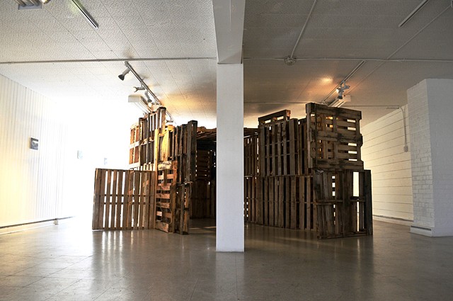 installation using painting and pallets society politics shelter home nomad bridge