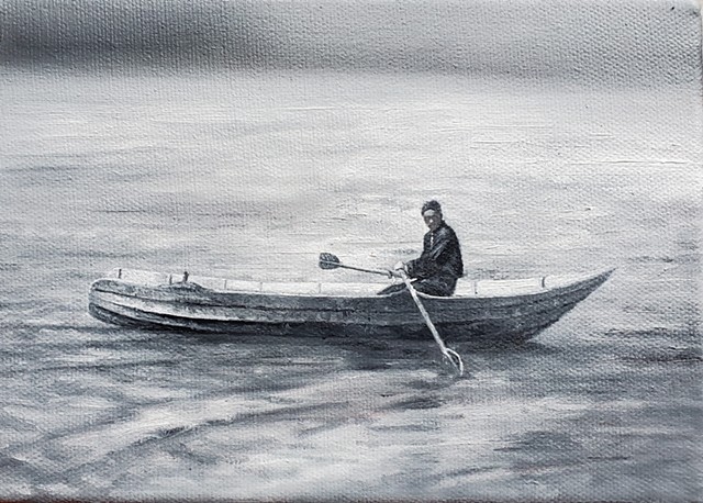 young man in row boat
